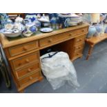 A VICTORIAN STYLE PINE PEDESTAL DESK.