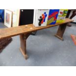 A RUSTIC OAK BENCH.