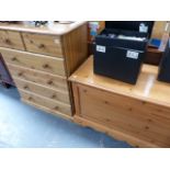 A PINE BLANKET BOX AND A PINE CHEST OF DRAWERS.