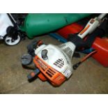A STHIL STRIMMER, AN ELECTRIC ROTOVATOR AND A GARDEN SPRAYER.