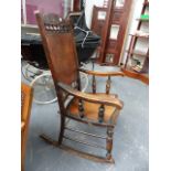 A LATE VICTORIAN ROCKING CHAIR.