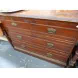 AN EDWARDIAN PINE CHEST OF DRAWERS.