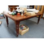 A VICTORIAN MAHOGANY WIND OUT DINING TABLE.