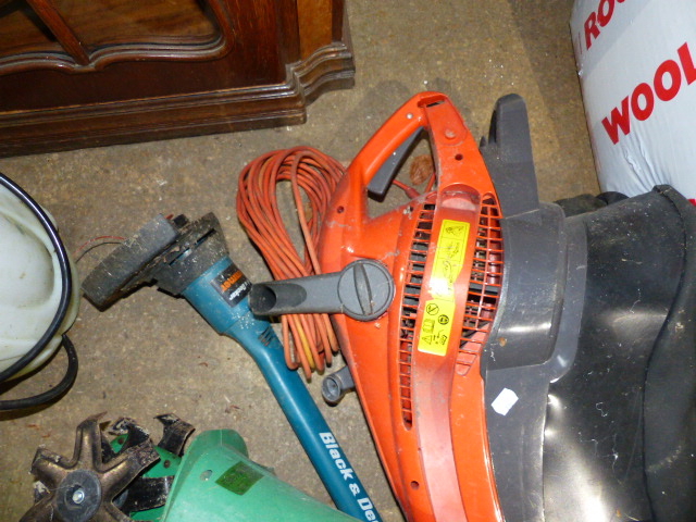 A FLYMO GARDEN VACUUM AND A STRIMMER.