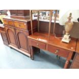 A COLONIAL TEAK SIDE TABLE AND A SIMILAR TWO DOOR CABINET.