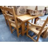 AN OAK DINING TABLE AND EIGHT CHAIRS.