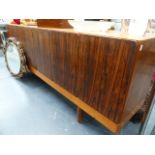 A GORDON RUSSELL TEAK AND ROSEWOOD SIDEBOARD.