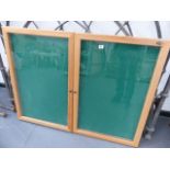 A GLAZED NOTICE BOARD CABINET.