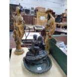 A PAIR OF ORIENTAL STYLE FIGURES AND A SMALL TABLE FOUNTAIN.