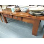 A RUSTIC STYLE PINE COFFEE TABLE.