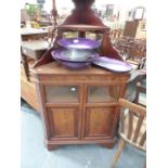 A VICTORIAN MAHOGANY PANEL DOOR CORNER CABINET.