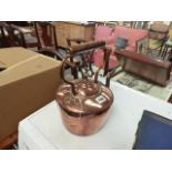 AN ANTIQUE COPPER KETTLE.