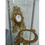 A VICTORIAN BRASS CASED EASEL BACK CLOCK AND A MIRROR.