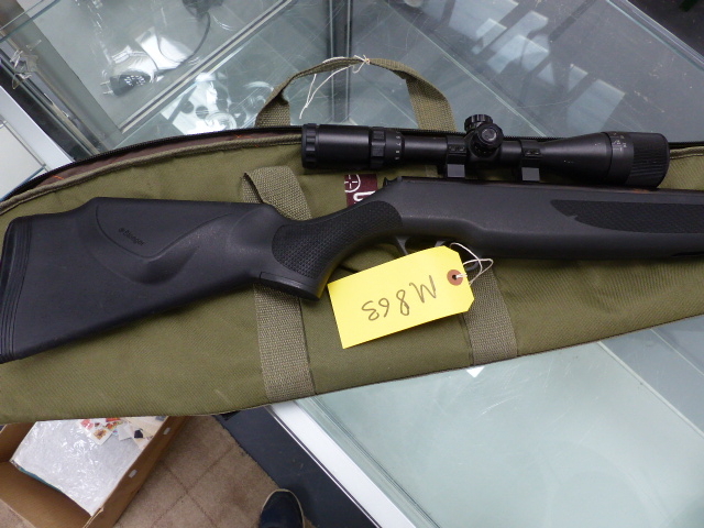 AN AIR RIFLE WITH TELESCOPIC SIGHT, CASED.