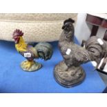 A CAST IRON COCKEREL DOORSTOP AND A FURTHER FIGURE OF A COCKEREL ON MARBLE BASE.
