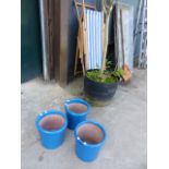 TWO DECK CHAIRS AND THREE GARDEN POTS.