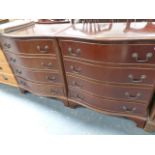 A PAIR OF GEORGIAN STYLE BOW FRONT CHESTS OF DRAWERS.