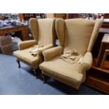 A PAIR OF WING BACK CHAIRS.