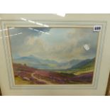 A WATERCOLOUR HIGHLAND LANDSCAPE SIGNED INDISTINCTLY AND A FURTHER WATERCOLOUR OF A CHURCH.