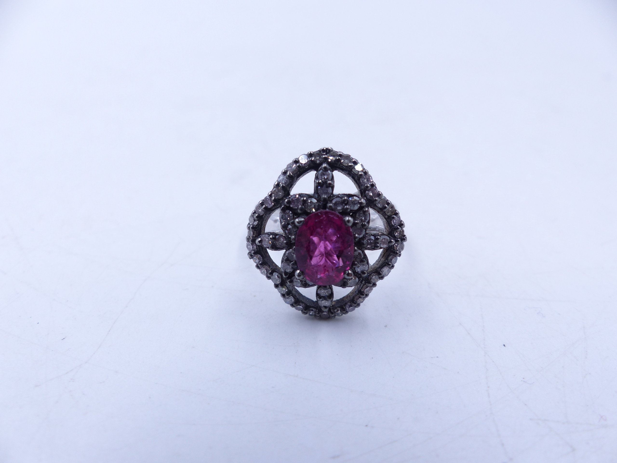 A PINK TOURMALINE AND DIAMOND OPEN WORK FILIGREE RING SET IN A WHITE METAL MOUNT,THE CENTRAL PINK - Image 11 of 17