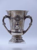 AN EDWARDIAN SILVER THREE HANDLED CELTIC DESIGINED LARGE LOVING CUP, DATED 1911 LONDON, POSSIBLY FOR