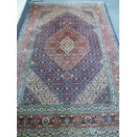 A PERSIAN TABRIZ CARPET. 196 x 294cms.