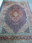 A PERSIAN TABRIZ CARPET. 196 x 294cms.