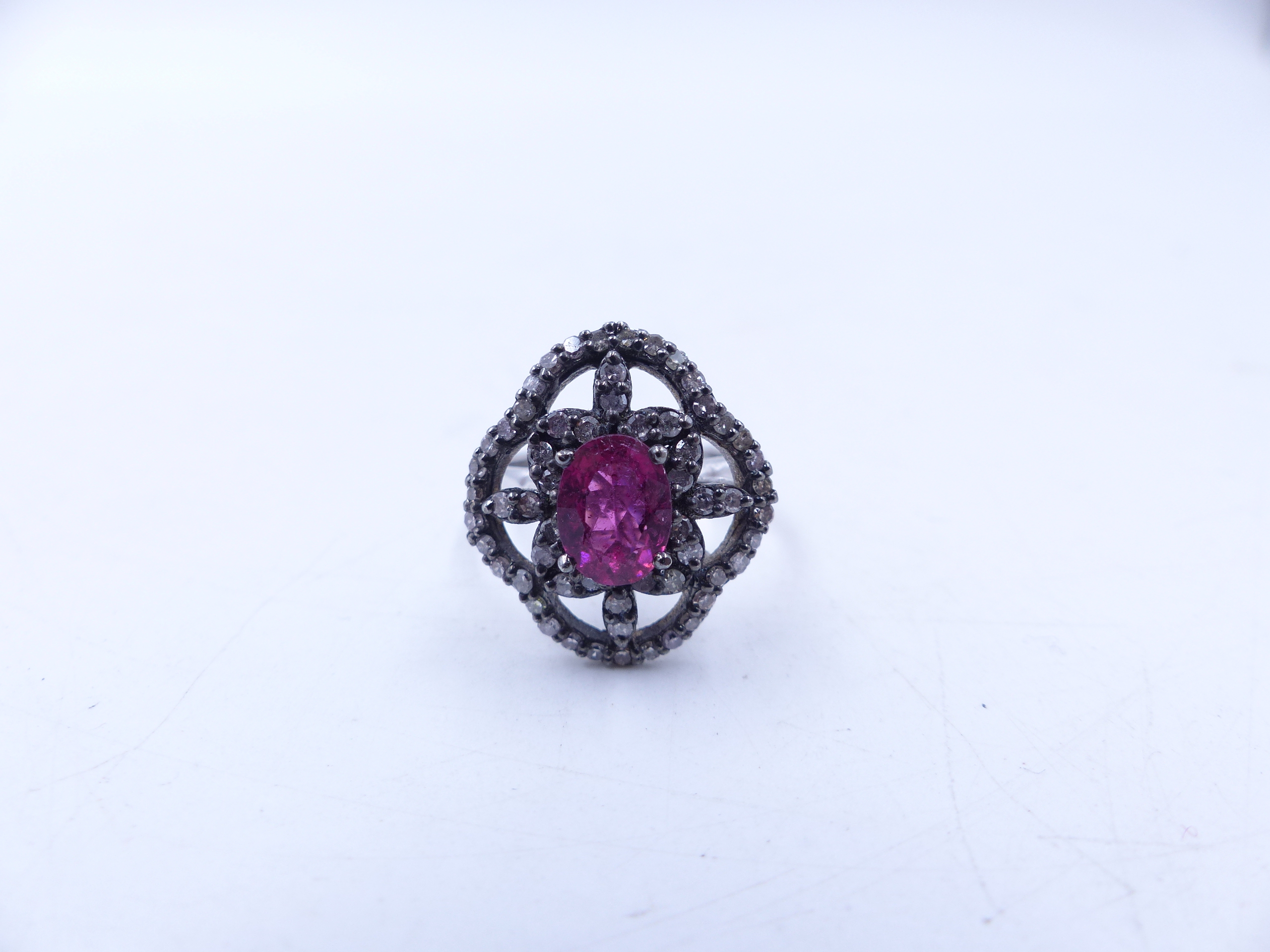 A PINK TOURMALINE AND DIAMOND OPEN WORK FILIGREE RING SET IN A WHITE METAL MOUNT,THE CENTRAL PINK - Image 12 of 17