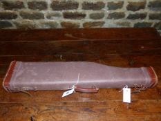 A CANVAS AND LEATHER LEG O'MUTTON GUN CASE.