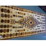 A NORTH AFRICAN TRIBAL RUG. 264 x 126cms.