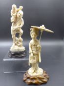 TWO JAPANESE CARVED IVORY FIGURES ON HARDWOOD BASES, A LADY HOLDING A PARASOL, OVERALL H.17cms