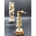 TWO JAPANESE CARVED IVORY FIGURES ON HARDWOOD BASES, A LADY HOLDING A PARASOL, OVERALL H.17cms