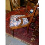 A REGENCY MAHOGANY OPEN ARMCHAIR.