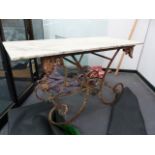 AN ANTIQUE FRENCH WROUGHT IRON BAKERS TABLE WITH MARBLE TOP. 137 x 61 x H.80cms.