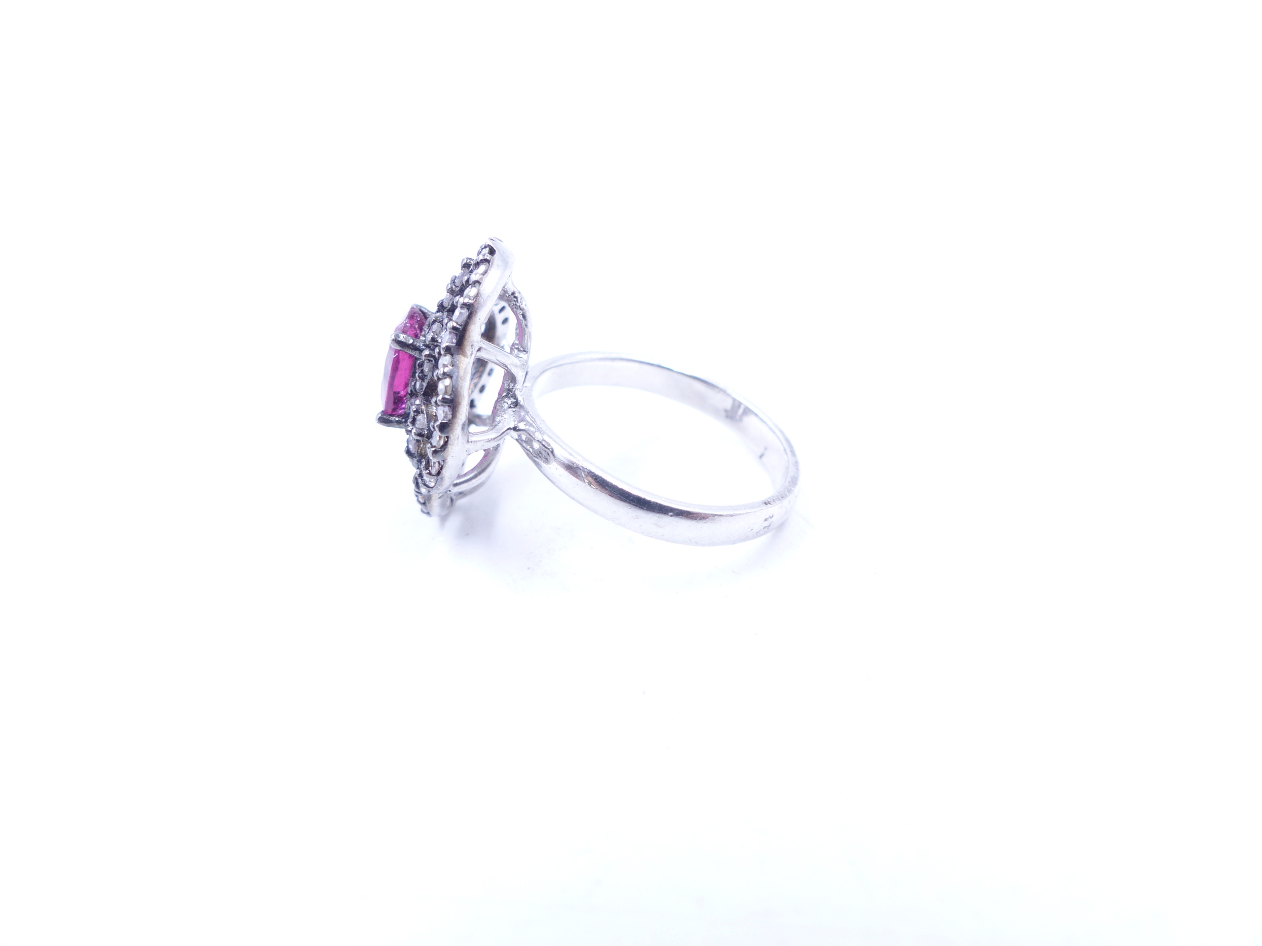 A PINK TOURMALINE AND DIAMOND OPEN WORK FILIGREE RING SET IN A WHITE METAL MOUNT,THE CENTRAL PINK - Image 2 of 17