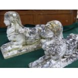 A PAIR OF ANTIQUE WEATHERED STONE FIGURES OF RECUMBENT SPHINX. L.77cms.