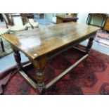 A GOOD 17th.C.STYLE OAK REFECTORY TABLE WITH CARVED FRIEZE AND STRETCHER BASE, THE TOP 184 x 81 x
