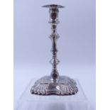 A SILVER GEORGE II STYLE TAPER STICK WITH DETACHABLE SCONCE, DATED 1895 LONDON, FOR THOMAS