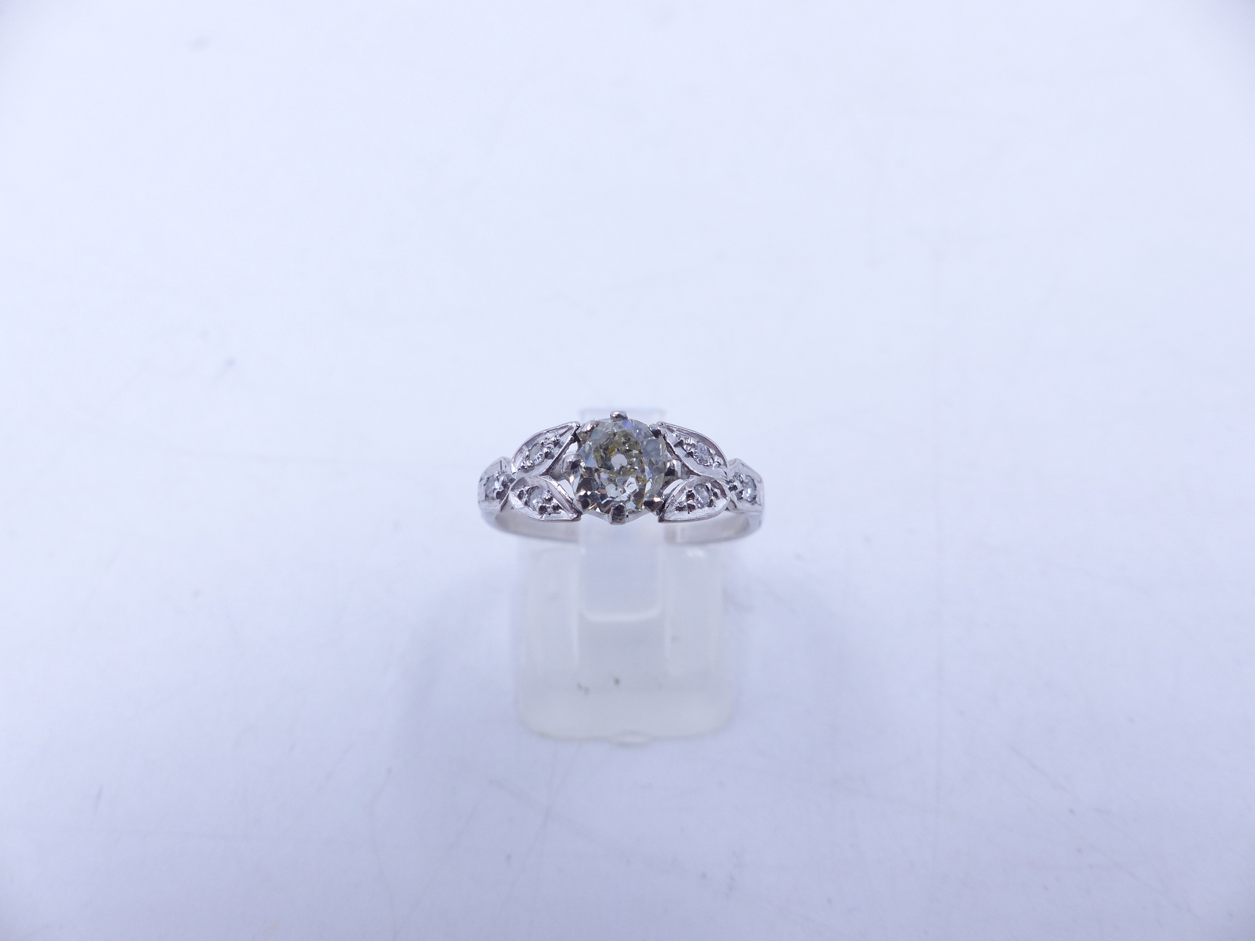AN 18ct STAMPED OLD CUT DIAMOND RING. THE CENTRAL OLD CUT DIAMOND IS HELD IN AN EIGHT CLAW SETTING - Image 10 of 14