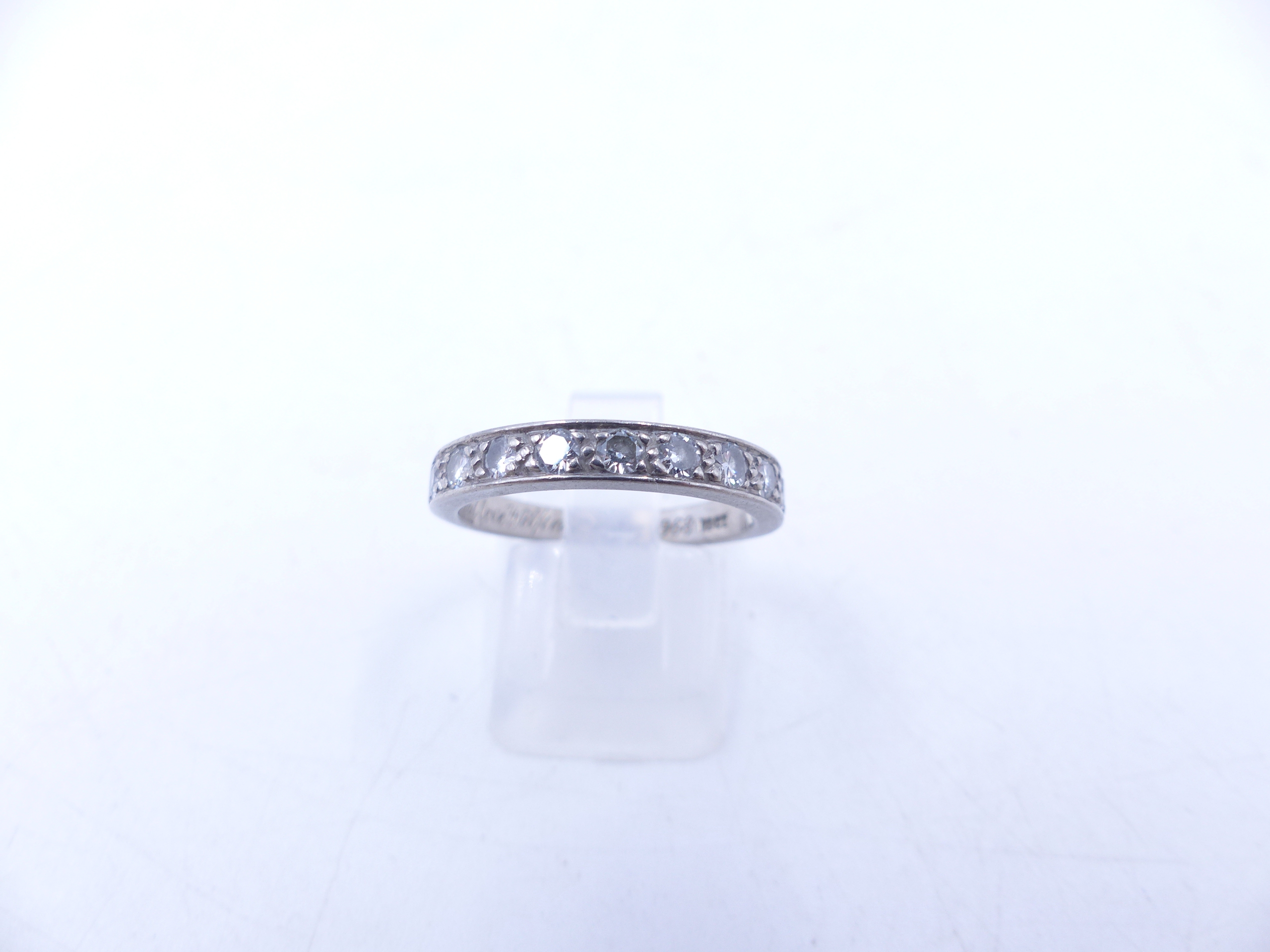 AN 18ct WHITE GOLD DIAMOND HALF ETERNITY RING WITH TEN BRILLIANT CUT PAVE SET DIAMONDS. FINGER