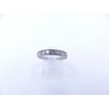 AN 18ct WHITE GOLD DIAMOND HALF ETERNITY RING WITH TEN BRILLIANT CUT PAVE SET DIAMONDS. FINGER