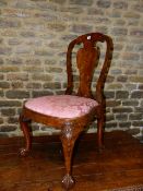 AN 18th.C.WALNUT SIDE CHAIR ON CARVED CABRIOLE FORE LEGS AND CLAW AND BALL FEET.