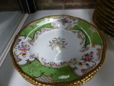 A COALPORT PART DINNER SERVICE, EACH PIECE WITH GILDED RIM, APPLE GREEN BAT SHAPED PANELS WITH