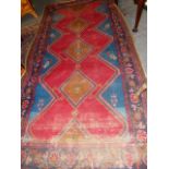 A PERSIAN HAMADAN RUG. 310 x 162cms.