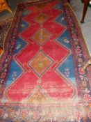 A PERSIAN HAMADAN RUG. 310 x 162cms.