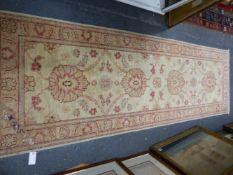 AN ORIENTAL RUNNER OF ZIEGLER DESIGN. 244 x 77cms.