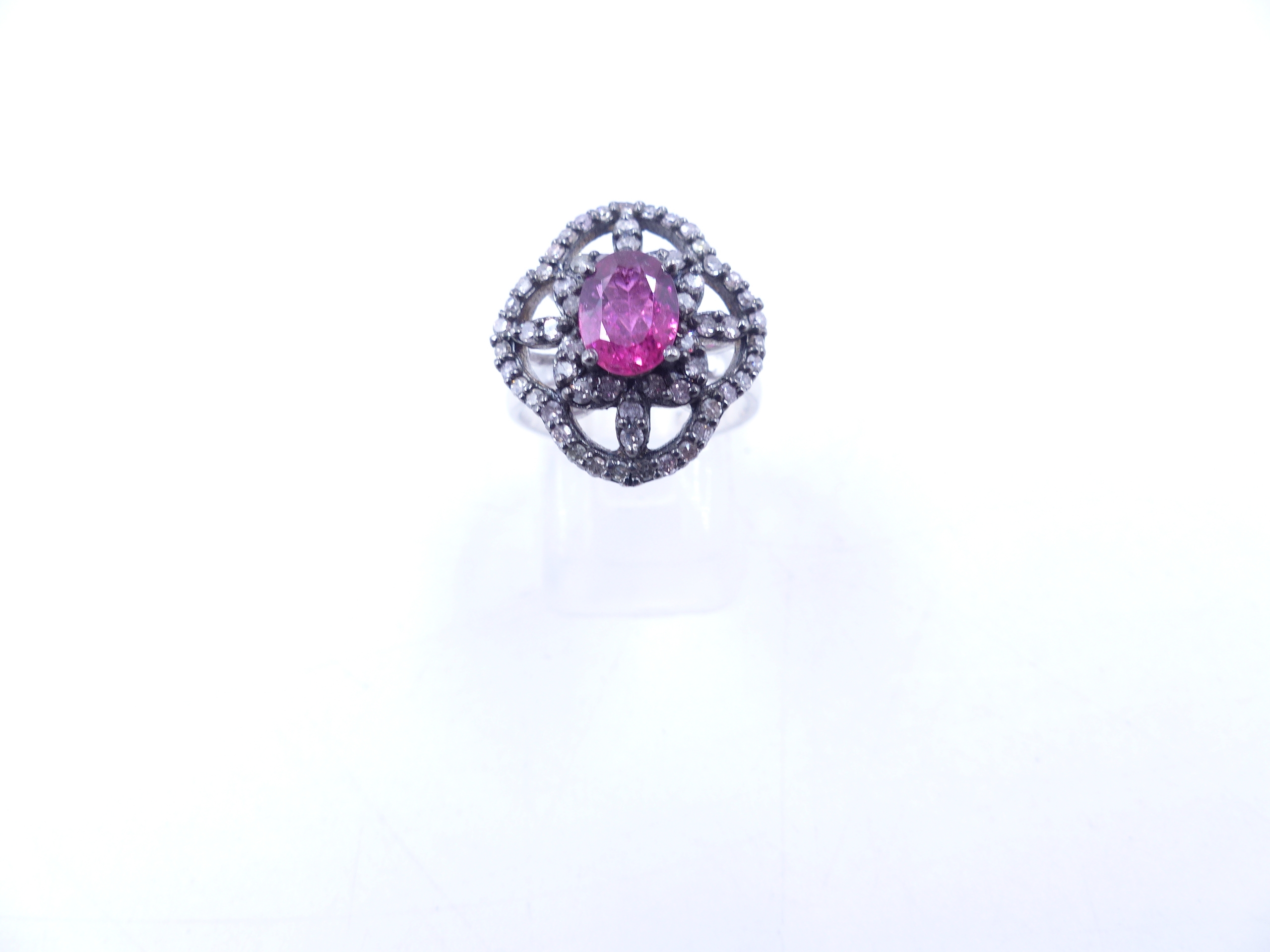 A PINK TOURMALINE AND DIAMOND OPEN WORK FILIGREE RING SET IN A WHITE METAL MOUNT,THE CENTRAL PINK - Image 16 of 17