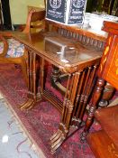 A QUARTETTO NEST OF MAHOGANY TABLES.