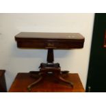 A PAIR OF REGENCY MAHOGANY FOLD OVER CARD TABLES ON SQUARE SECTION SUPPORT AND SHAPED QUADROPED
