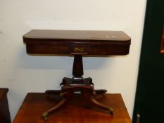 A PAIR OF REGENCY MAHOGANY FOLD OVER CARD TABLES ON SQUARE SECTION SUPPORT AND SHAPED QUADROPED